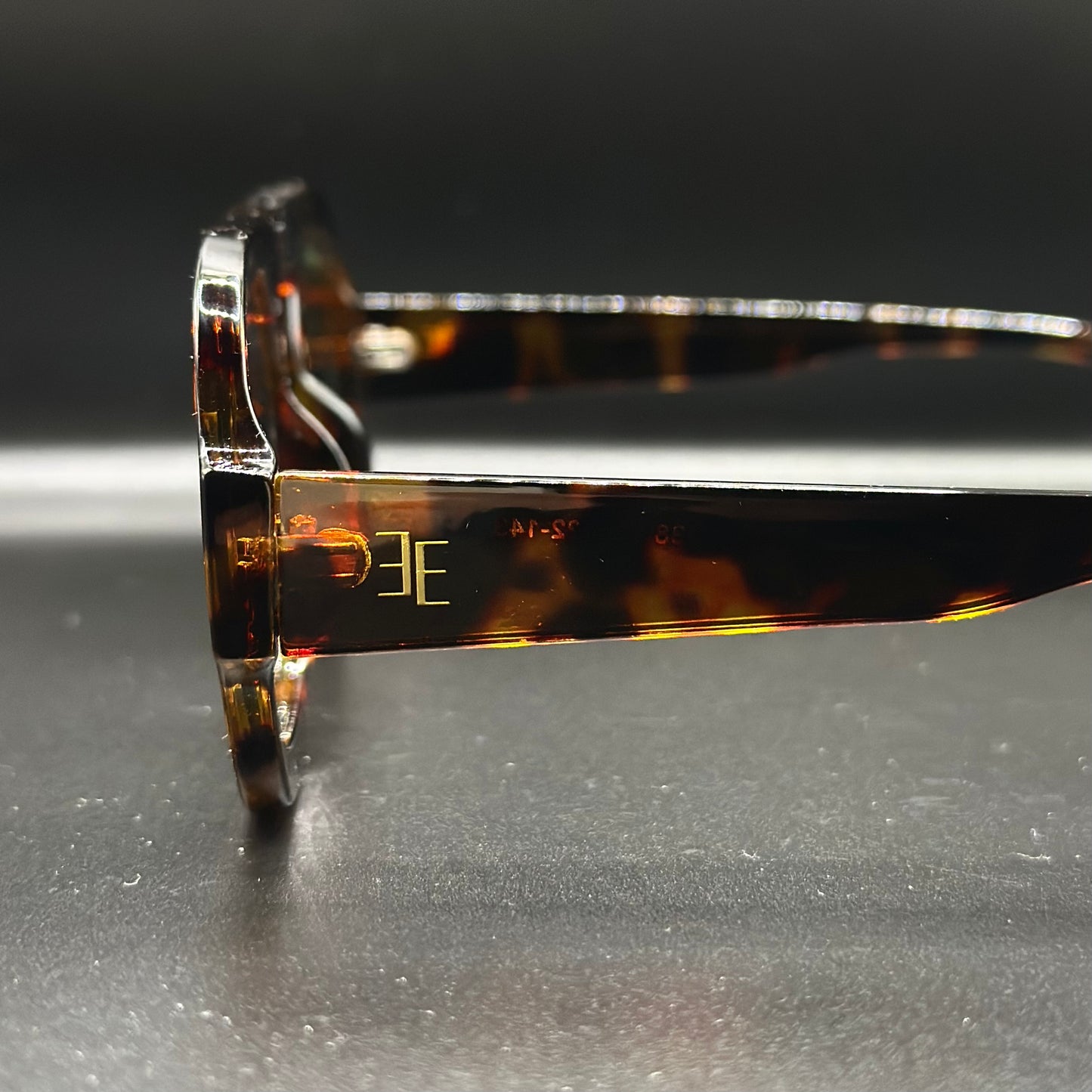 metro. (tortoise shell w/ green lens)